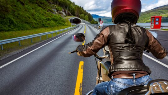 Biker girl First-person view, mountain serpentine.
